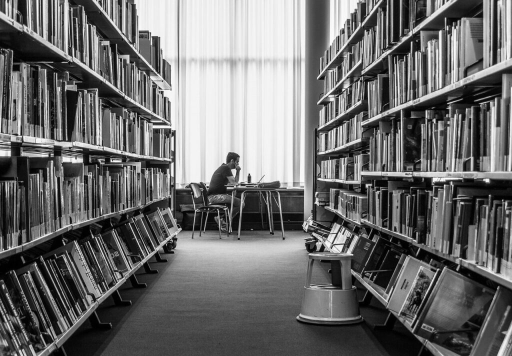 person sitting in a library.