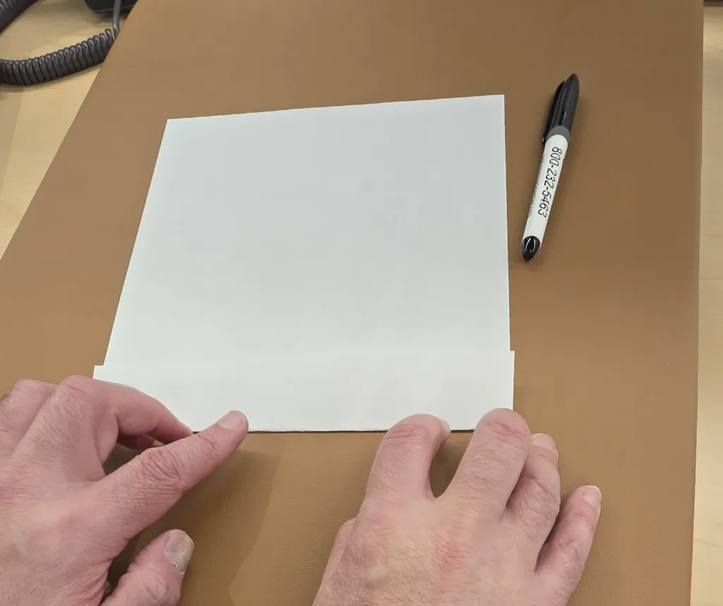 Person makes another fold on the paper