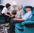 Older couple talking with mental health worker