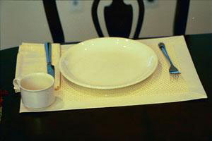white place setting on white placemat