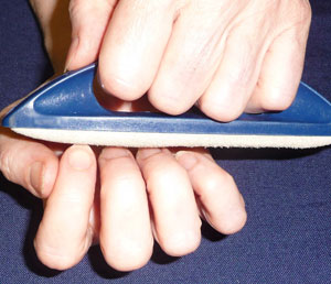 Hands using a nail buffer
