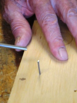 nail is inserted into the wood