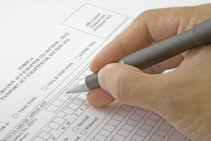closeup of person filling out an application form