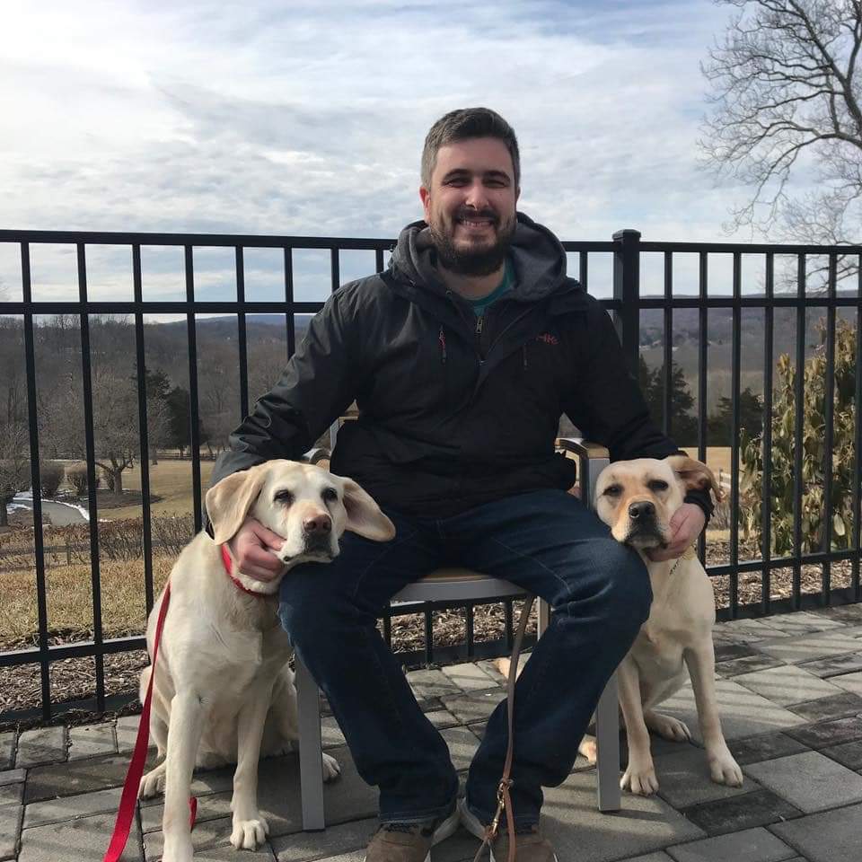 Photo of Michael Forzano with his two dogs