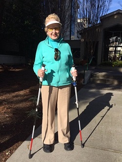 Barbara standing with ski supports