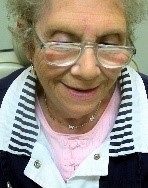 woman wearing magnifying reading glasses