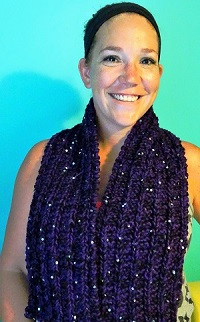 Young woman wearing a purple knitted scarf