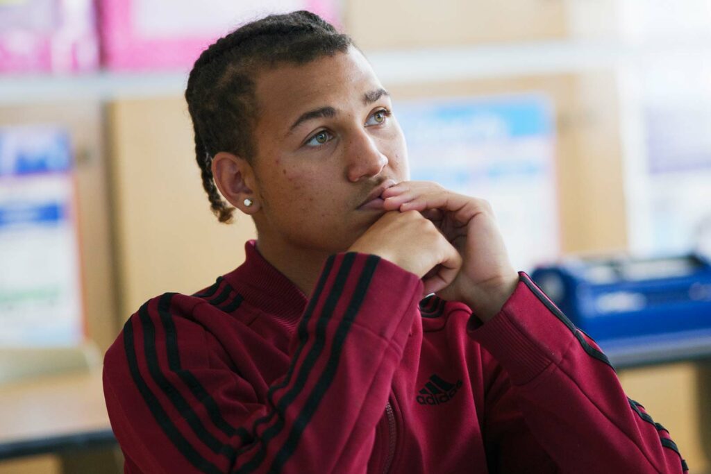 A student looking off to the distance.