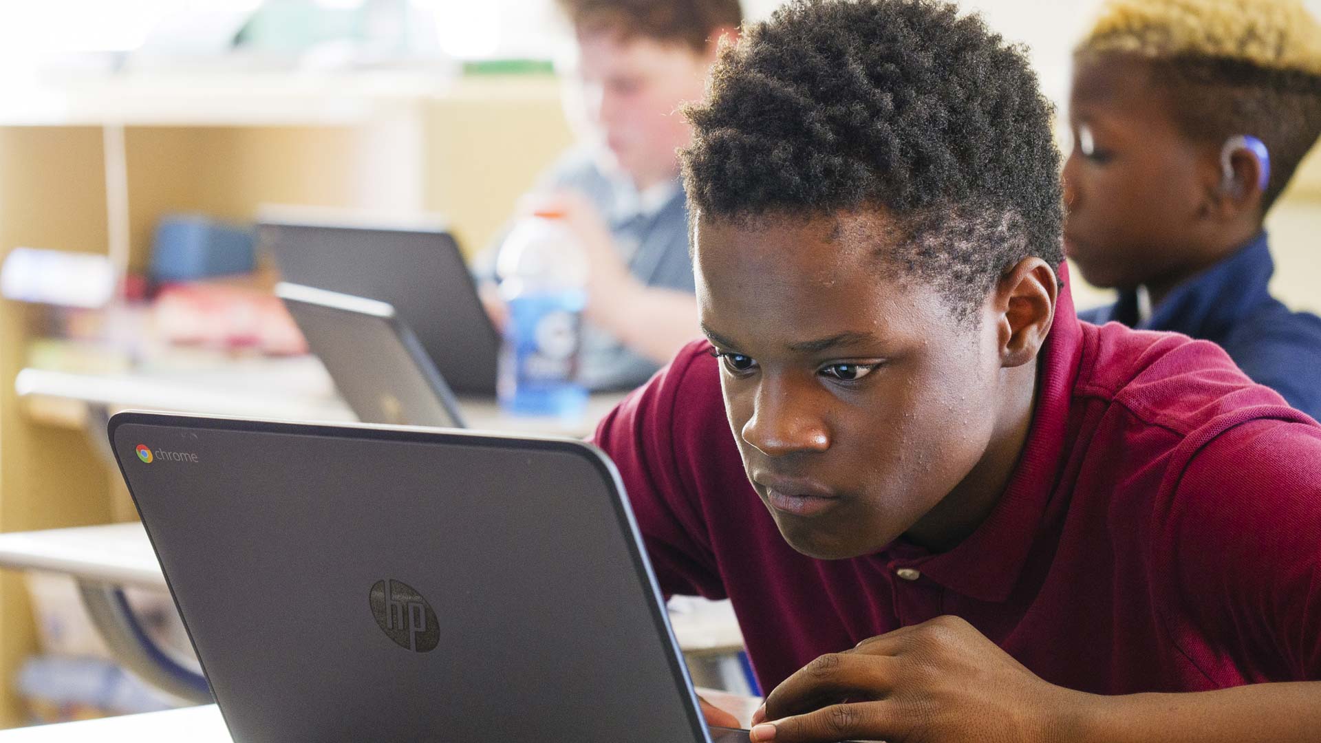 Male student using a laptop computer