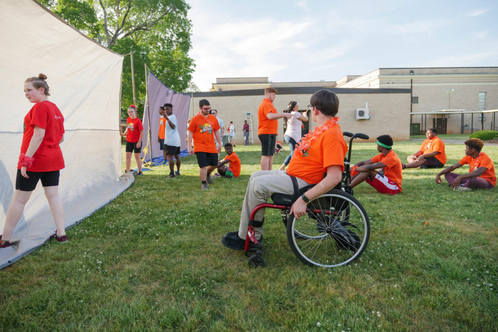 A group of students playing blind volleyball.