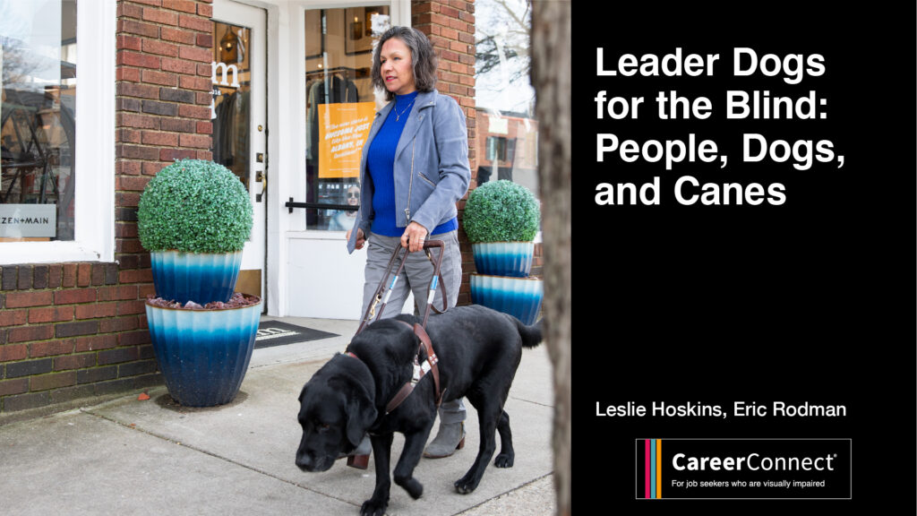 Professional woman walking outdoors with a black lab guide dog