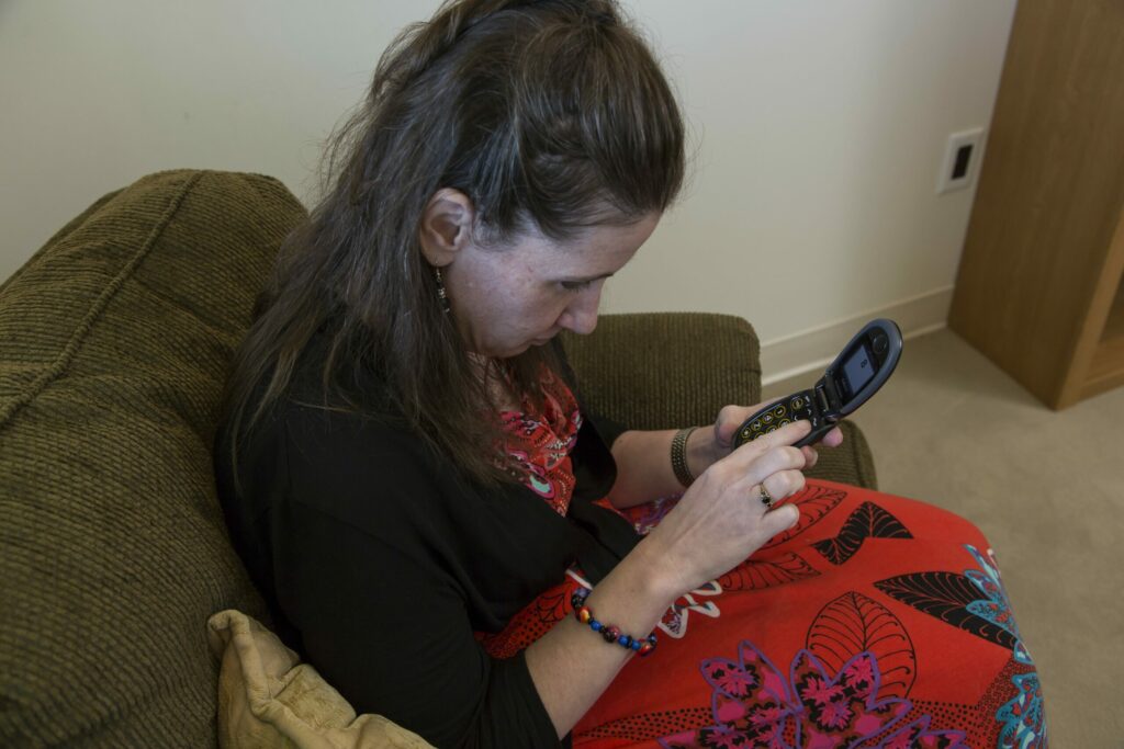 Person holds flip phone