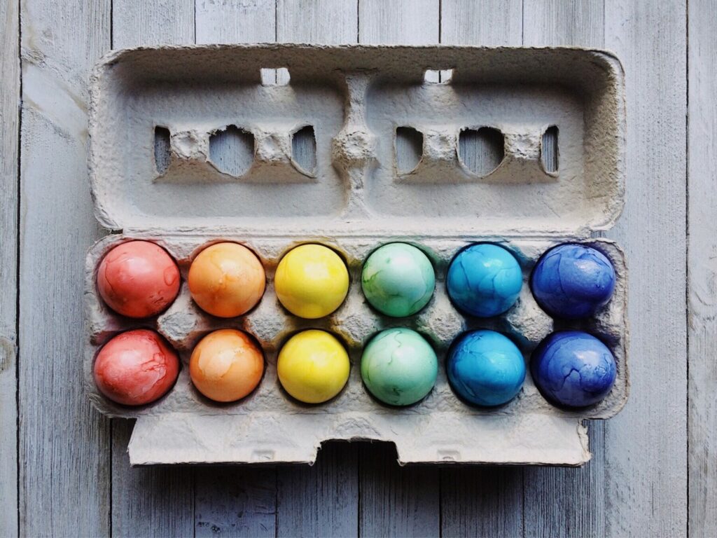 A carton of colorful eggs.