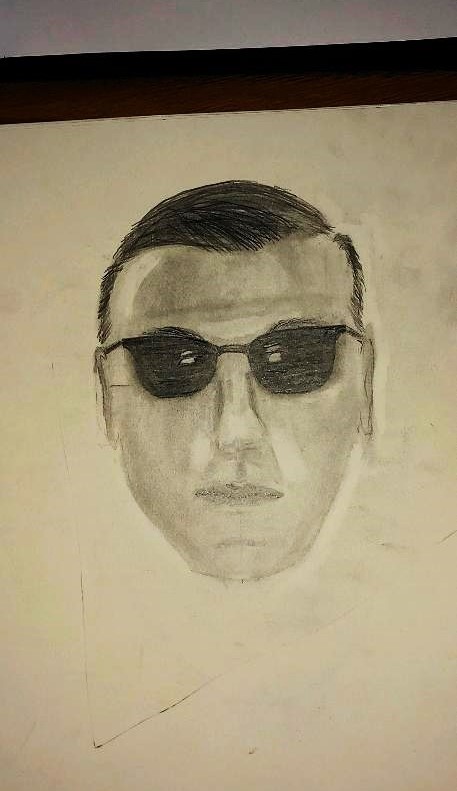 a pencil drawing of a person's face wearing sunglasses