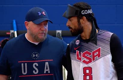 Goalball coach talks with player in USA team jersey