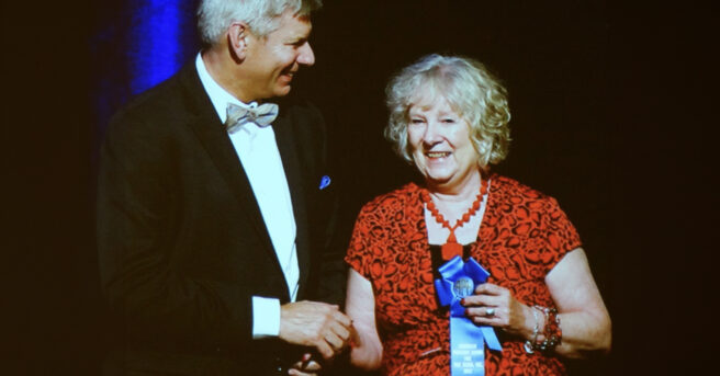 Lynda Lambert receiving an award