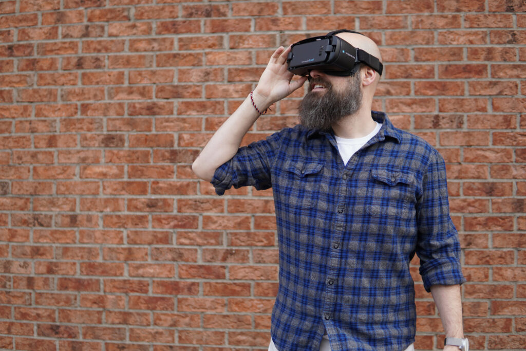 Individual holding a VR headset