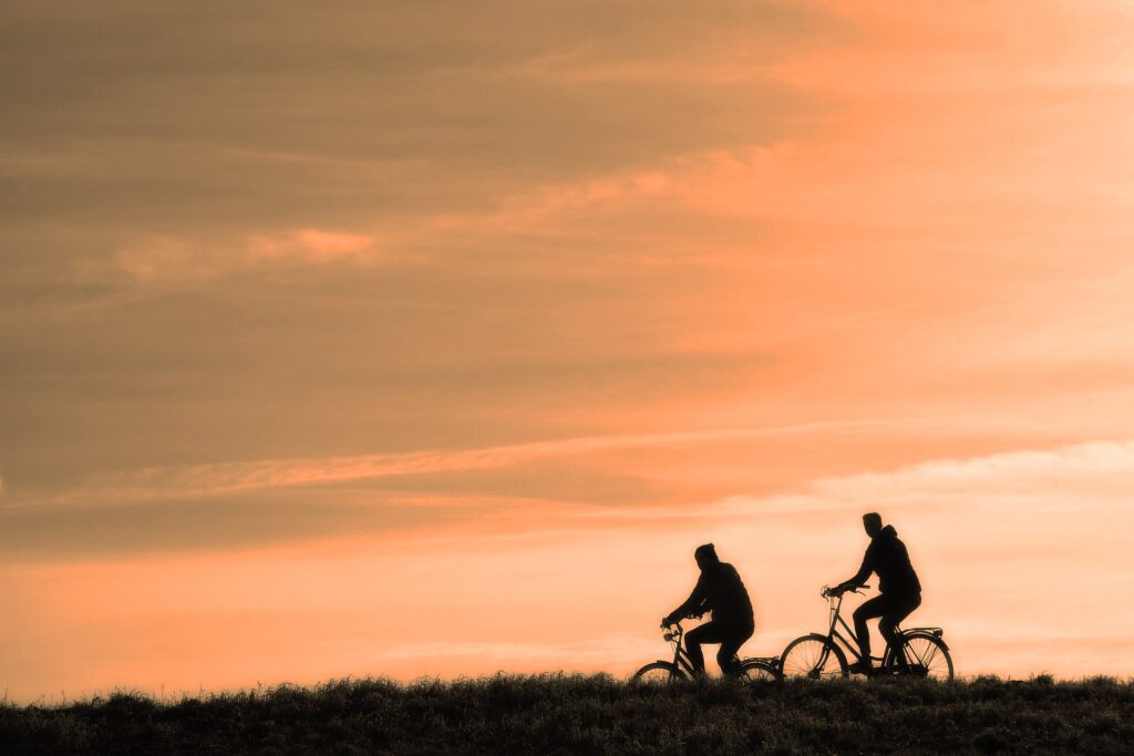 Silhouette of two cyclists