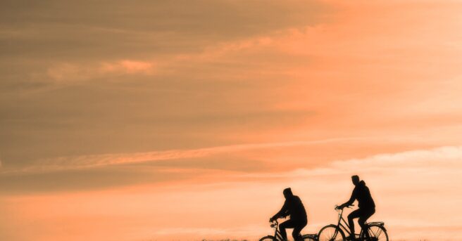 Silhouette of two cyclists
