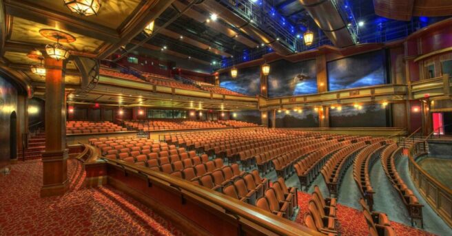 Large movie theater with many rows of seats.