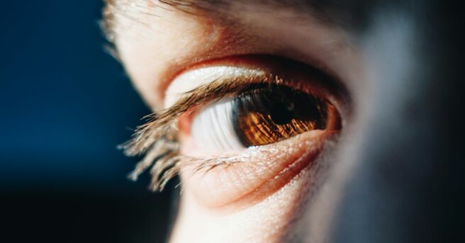 person looking at camera prosthetic ocular lens