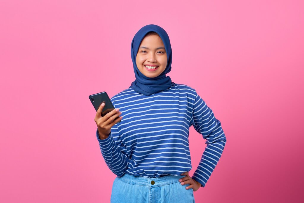 young adult smiling confidently at the camera
