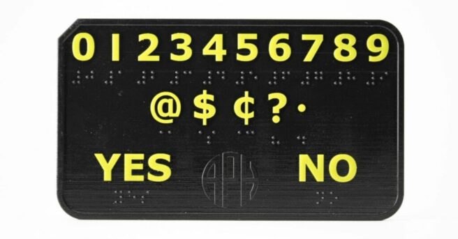 DeafBlind communicator device with 0-9 across the top. on the middle line: @$cents ? and the period sign. Yes and no are on the bottom line. all in braille