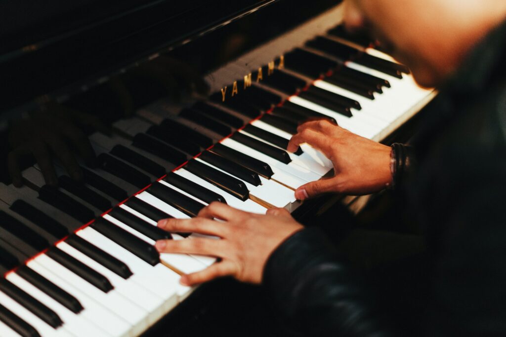 Close-up of person playing the piano