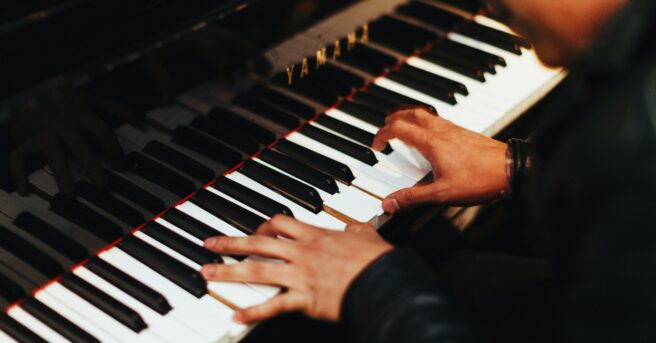 Close-up of person playing the piano