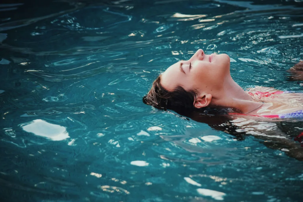 woman swimming on her back