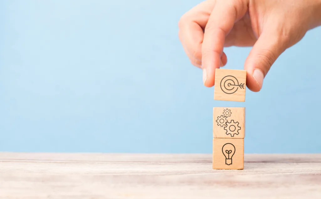 Small wood blocks being stacked, idea, work, and target.