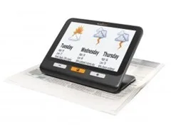 hand held magnifier magnifying a newspaper