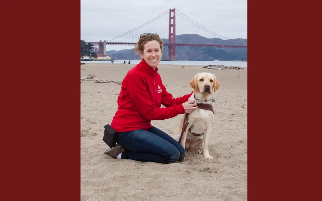 Jane with her dog Pilaf in Chrissy Field in front of the Golden Gate Bridge.