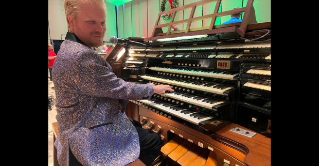 Jason playing an electronic organ