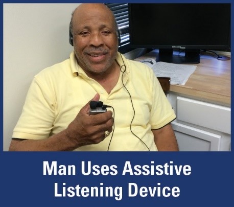 man using assistive listening device