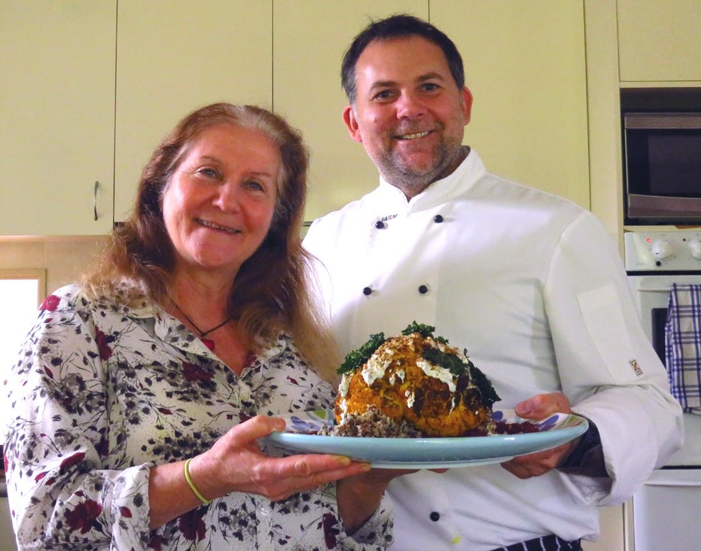 Maribel and Chef holding a completed and lovely food dish