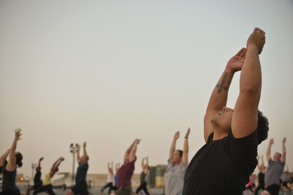 Group of people stretching outdoors