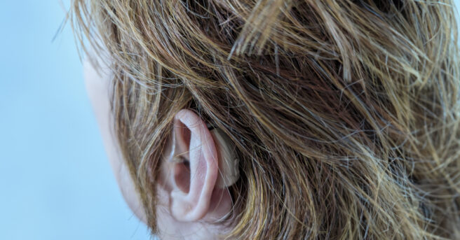 closeup of hearing aid in ear