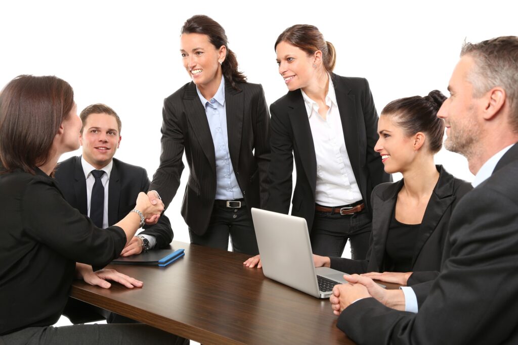 A group of businesspeople introducing themselves to each other at a table. 