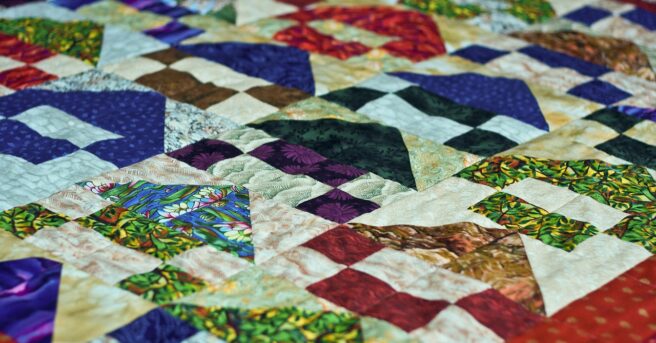 Quilt made up of many colors and fabrics