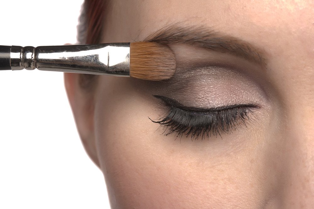 Close-up of eye makeup application