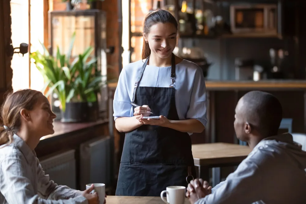 Two people ordering in a restaurant