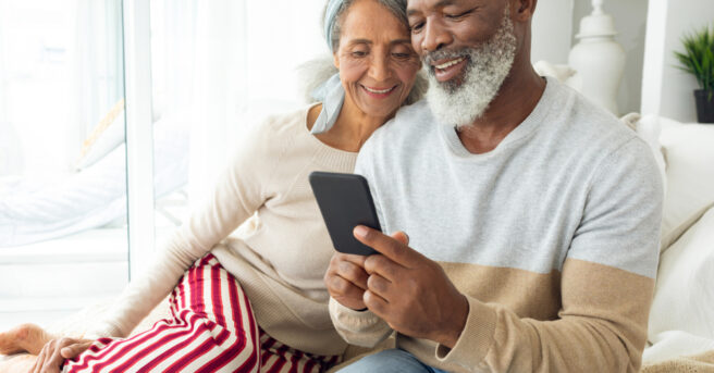 Older couple use a smartphone