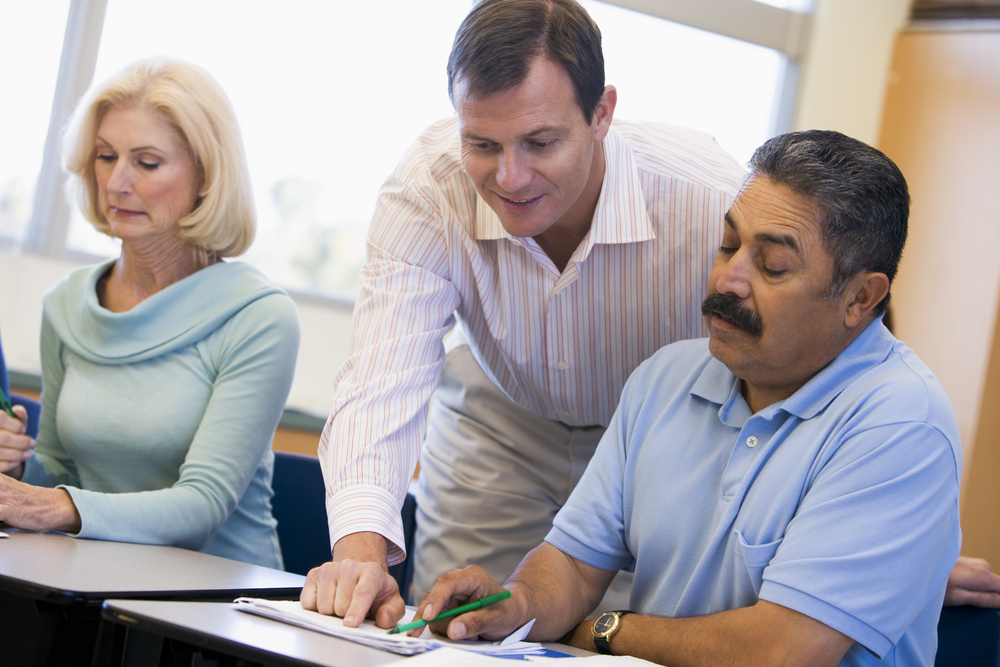 Adult teaching two adult learners
