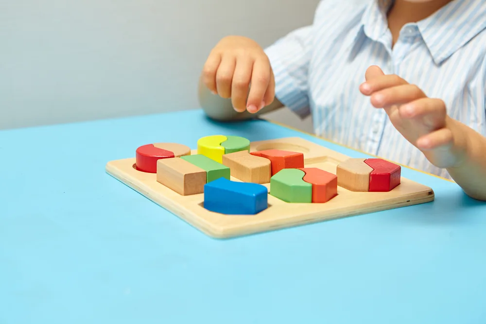 Child completes a puzzle