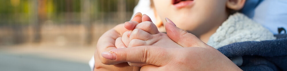 Mom make hand gesture practice nonverbal talk with little girl child, positive female teacher 