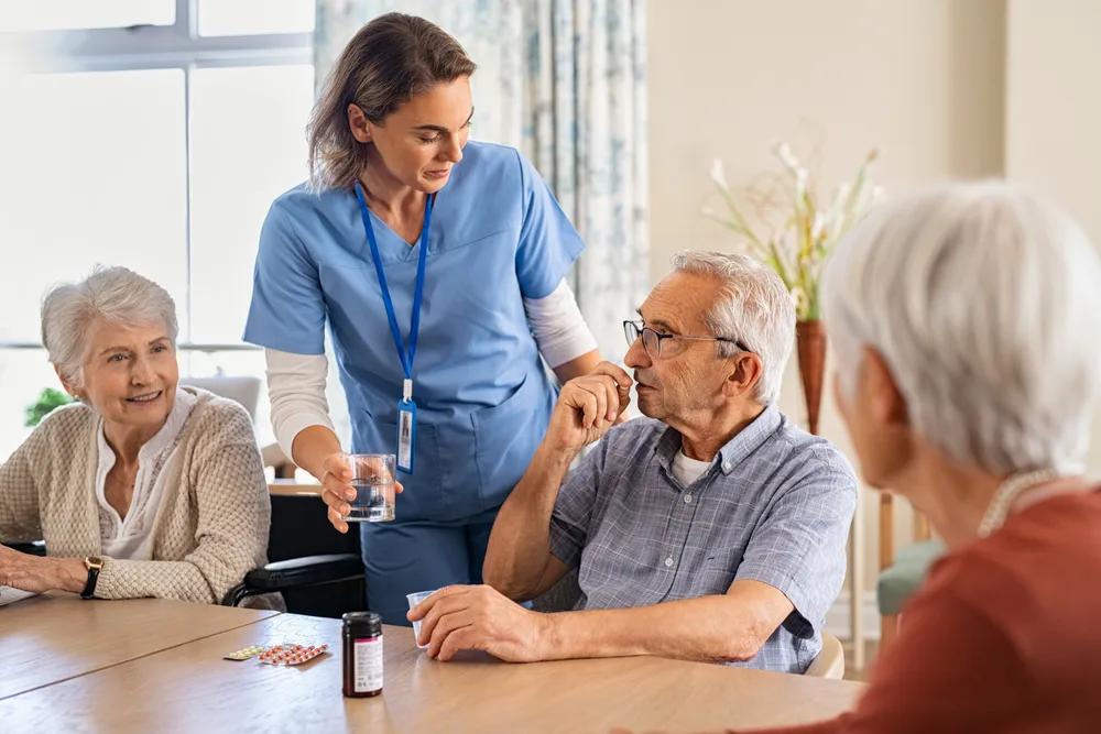 Nurse talking with a group of older people