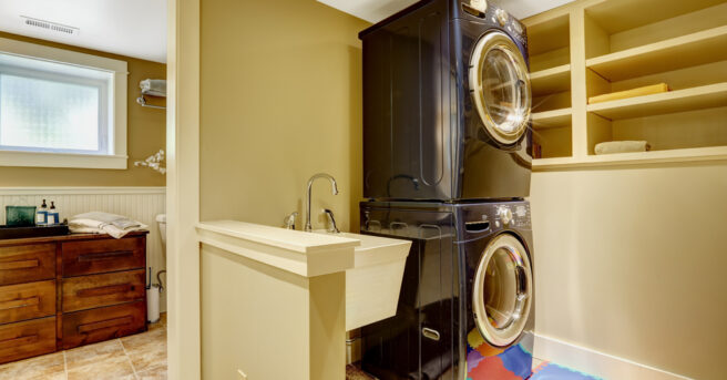 Laundry room with adequate lighting, a non-slip mat, and machines with high color contrast from the walls and floor