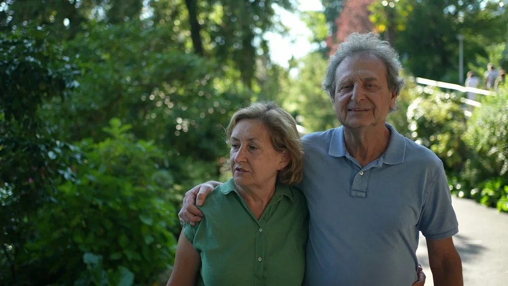 Couple walking arm in arm