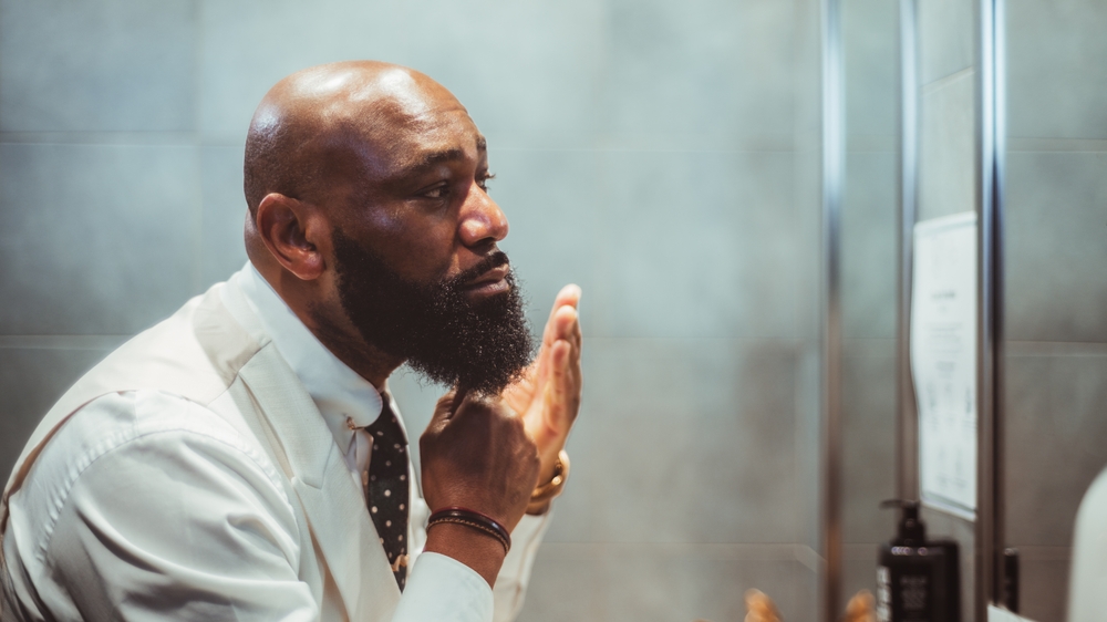 Person grooming their beard